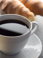 Cup of coffe and croissants