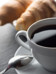 Cup of coffe and croissants