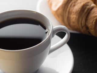 Cup of coffe and croissants