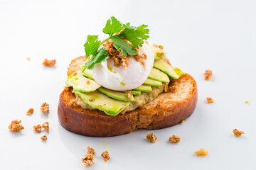 sandwich with poached egg and avocado isolated on a white background