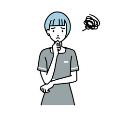 立って手をあごにあてて困っているエステ店員の女性