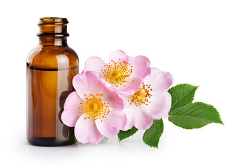 Obraz na płótnie Canvas Bottle with essential oil from rose. Flower rose hips isolated on white background. With clipping path.
