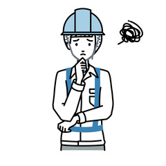 立って手をあごにあてて困っている工事現場の女性