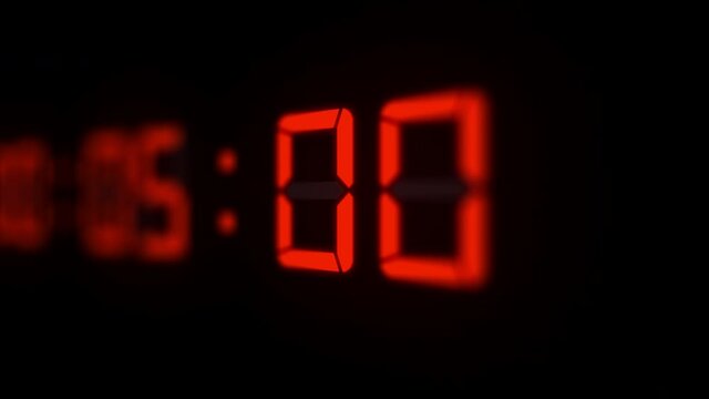 3D animation of red 60 fps timecode led/LCD digits on black background with shallow DOF.