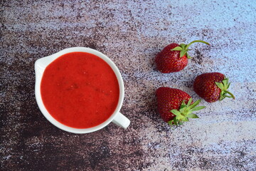 Homemade strawberry dressing in a jug. Flat lay