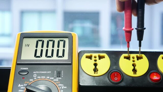 Measure the AC voltage of 230 Volts from the power outlet with a digital meter.