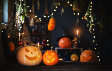 Fototapeta premium Halloween pumpkins on old wooden table on background Halloween decorations