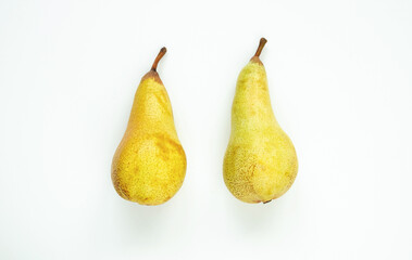 Two healthy, delicious pears on a white background, flat lay composition.