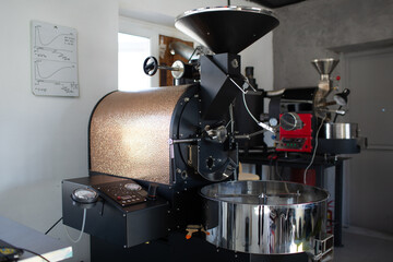 Coffee roaster machine at coffee roasting process.