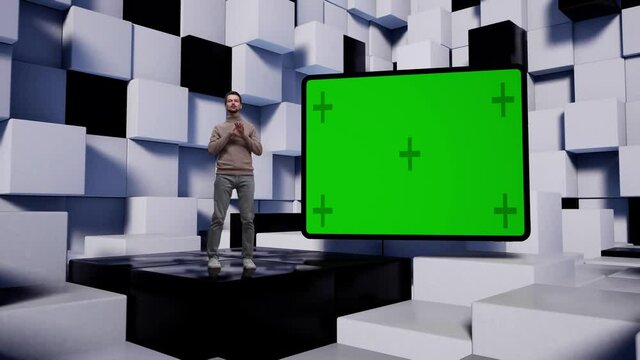 Caucasian man in sweater and jeans TV presenter in the news studio with white and black cubes. Green screen fly with markers in the form of tablet.