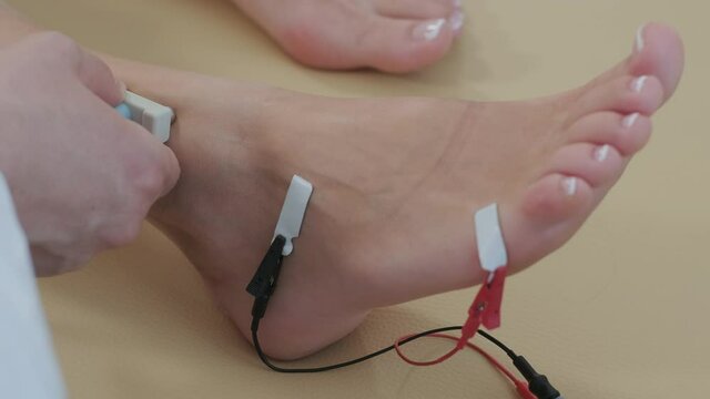 Patient nerves testing using electromyography at medical center