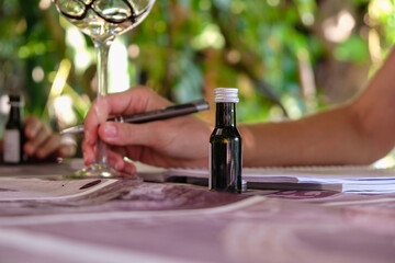 Bottle. Wine sample. Learning process of the tasting course.