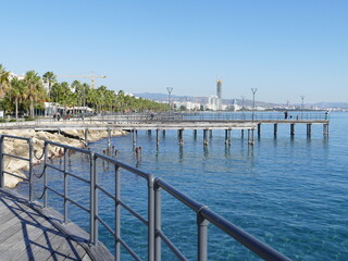 Fototapeta premium Wooden footbridges, wooden platforms, ponds and water together make the elegant promenade of Limassol, Lemesos, Cyprus