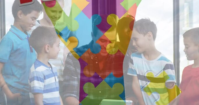 Animation of colourful puzzle pieces over kids and man using electronic devices