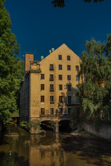 Old color big house mill in Litomerice town in north Bohemia in summer evening
