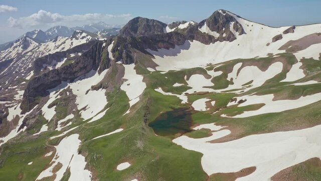 4K Spring time at Verlinga alpine lake on Mount Lakmos in Chaliki, Trikala, Thessaly, Greece