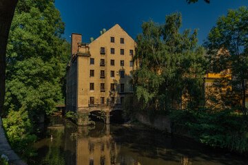 Fototapeta na wymiar Old color big house mill in Litomerice town in north Bohemia in summer evening