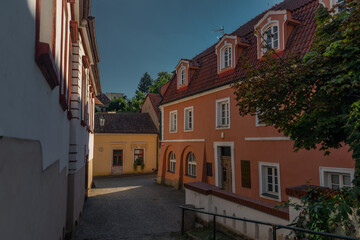 Fototapeta na wymiar Old color street and houses in Litomerice town in color summer evening