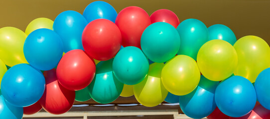 Garland of a long range of multicolored balloons