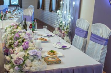 festive wedding table in a restaurant at a banquet with food and drinks