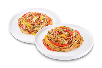 Buckwheat pasta with chicken, mango and red pepper in a plate on a white isolated background