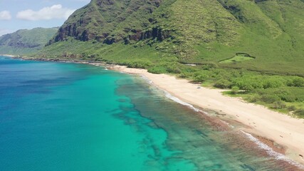 Fototapeta na wymiar Aerial view from above down Drone shot. Beautiful tropical beach sea with white sand. Top view. Empty and clean beach in summer season on Oahu Hawaii Island.