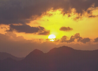Fototapeta na wymiar Sunrise or sunset behind the mountain
