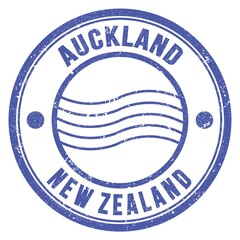 AUCKLAND - NEW ZEALAND, words written on light blue postal stamp