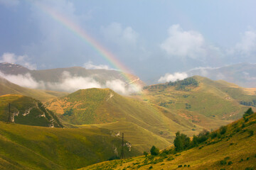 Beautiful mountain landscape with a rainbow. Mountains of the Republic of Dagestan, Russia