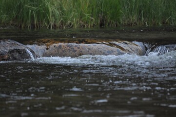 water flowing into the river