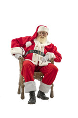 Senior male actor old man with a real white beard in the role of Father Christmas.