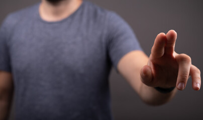 Businessman pointing or touching finger in screen..