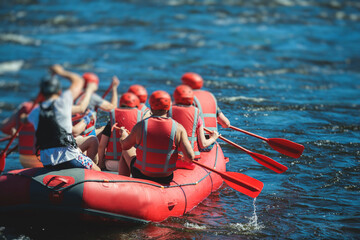 Raft boat during whitewater rafting extreme water sports on water rapids, kayaking and canoeing on...