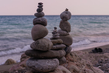 Fototapeta na wymiar Stone zen towers on a beach