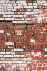 Old brick wall of bricks of different textures as the background