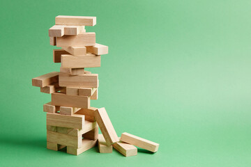 Close-up of wooden blocks game jenga fallen tower