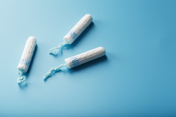 Gynecological tampons on a blue background top view