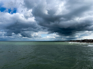 Dark clouds at the sea, stormy weather, dramatic seascape