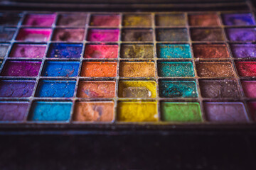 Makeup case and accessories. Make-up kit. Brushes and colored case for feminine beauty care.
