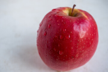 red apple with water drops