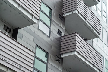 Metal clad balconies on a high rise residential building.