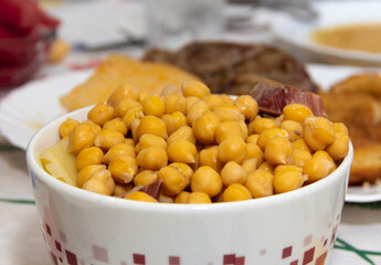 Chickpeas cooked in a bowl. Spanish stew. Copy space. Food. Selective focus.