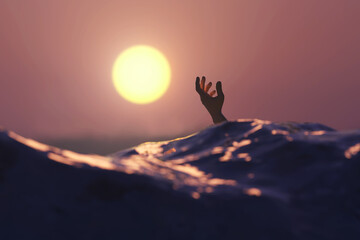 the hand of a man drowning in the sea
