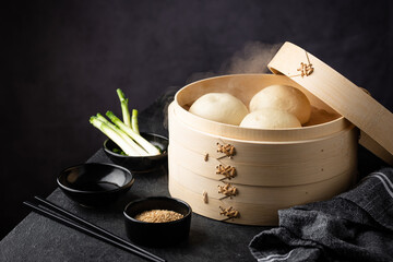 Chinese steamed buns baozi with steamer - obrazy, fototapety, plakaty