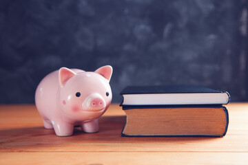 piggy bank and books on the table