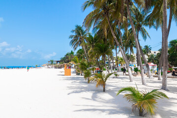 ISLA MUJERES, MEXICO - July 09, 2021: Beach with white sand, sunbeds and people in Isla Mujeres....