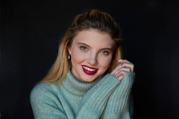 Winter wearing. Young beautiful blonde woman portrait