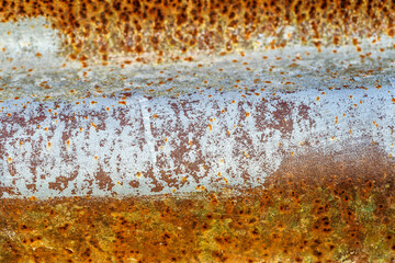 Background of peeling paint and rusty old meta. Little black dots and scratches. Corrosion of...