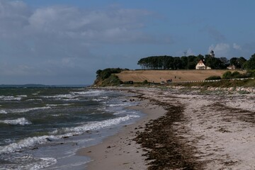 View to Drejet beach with the lighthouse Kegnaes Fyr	 on the Danish island of Alsen