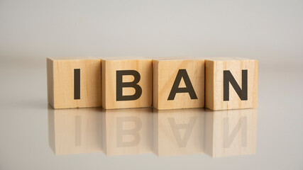 Four wooden cubes with letters IBAN. Business marketing concept.